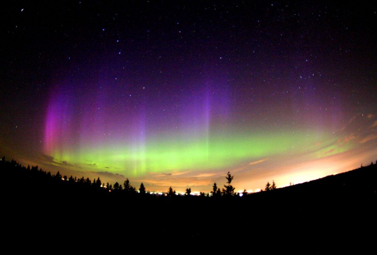 An Aurora - Charged Particles of Solar Wind Interact with the Ionosphere