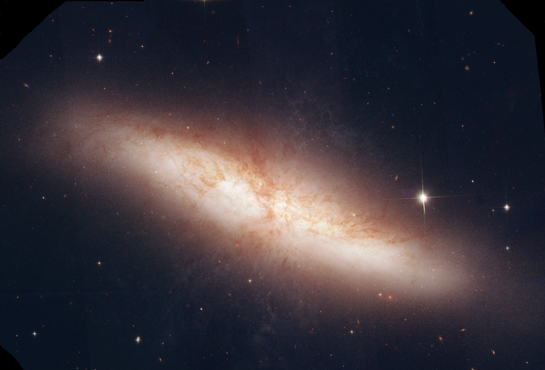 This is a mosaic of M82 taken by the Hubble Space Telescope. Using data from MAST, I used MaxIm DL and PhotoShop CS3 to process and assemble this image. Because the Hubble is in space, there are no atmospheric limitations which results in not only a striking image of the galaxy, but of the tiny galaxies that are peripheral to intended object. M82 is a cigar shaped irregular galaxy in the constellation Ursa Major.