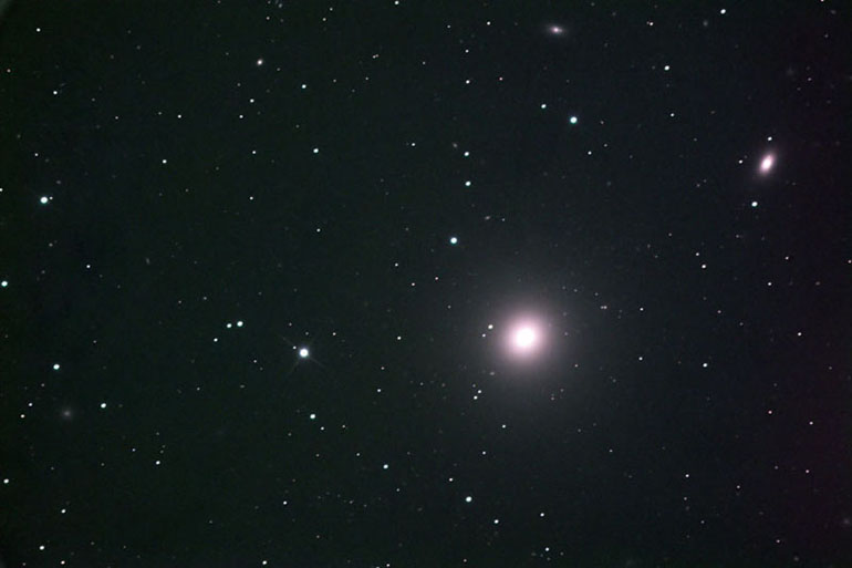 This is elliptical galaxy M84, member of the Virgo cluster.